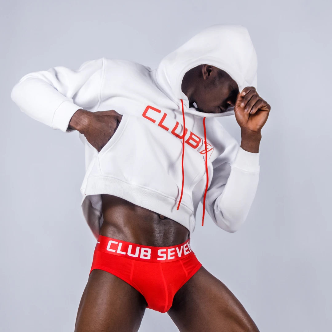 Male model wearing white hoodie and red underwear