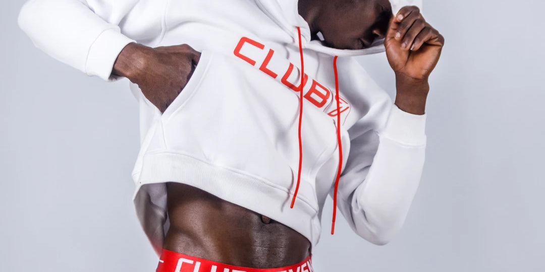Male model wearing white hoodie and red underwear