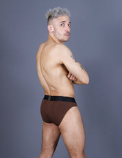 Man wearing brown briefs with big pouch back view