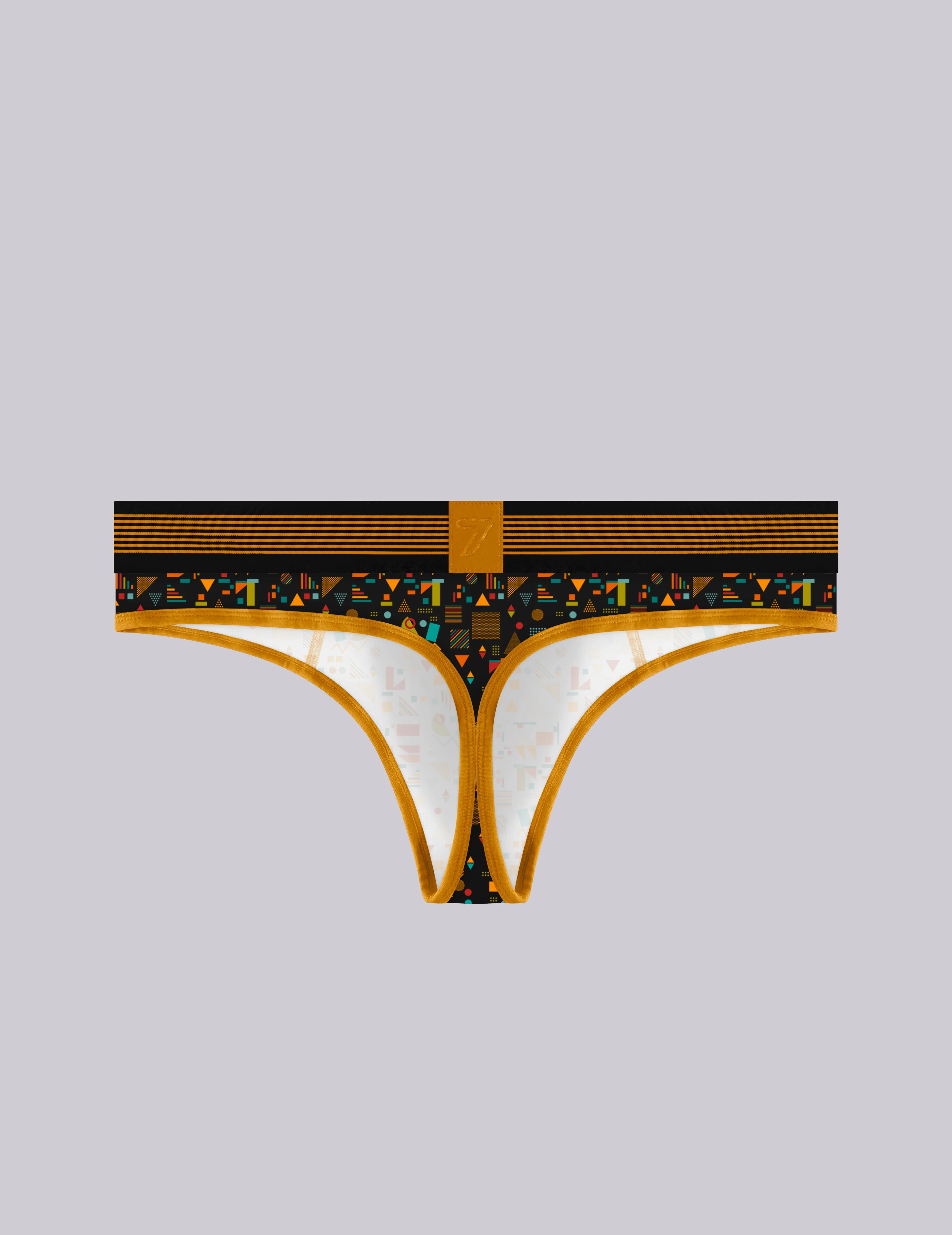 A pair of men's thong-style print underwear with a black and gold patterned waistband, 