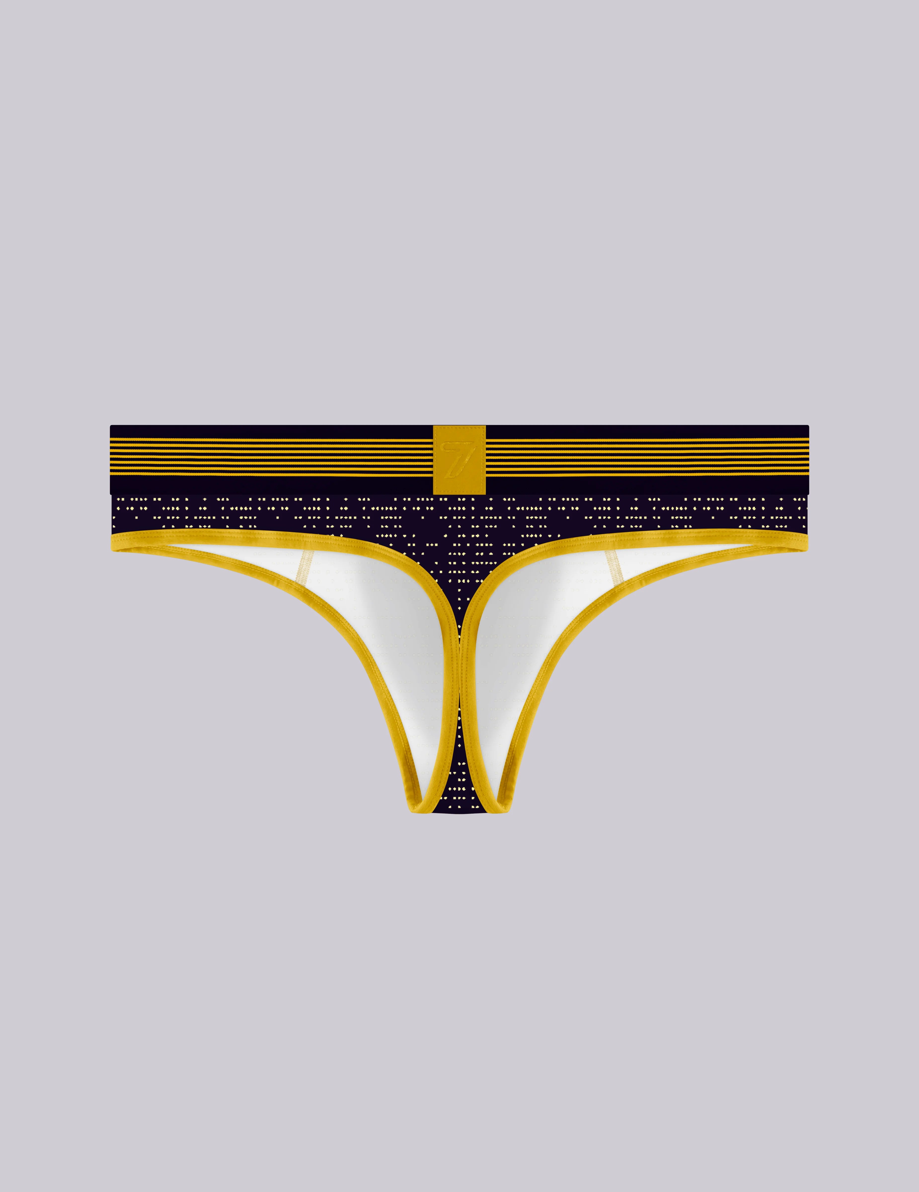 A pair of men's thong-style print underwear with a black and gold patterned waistband, 