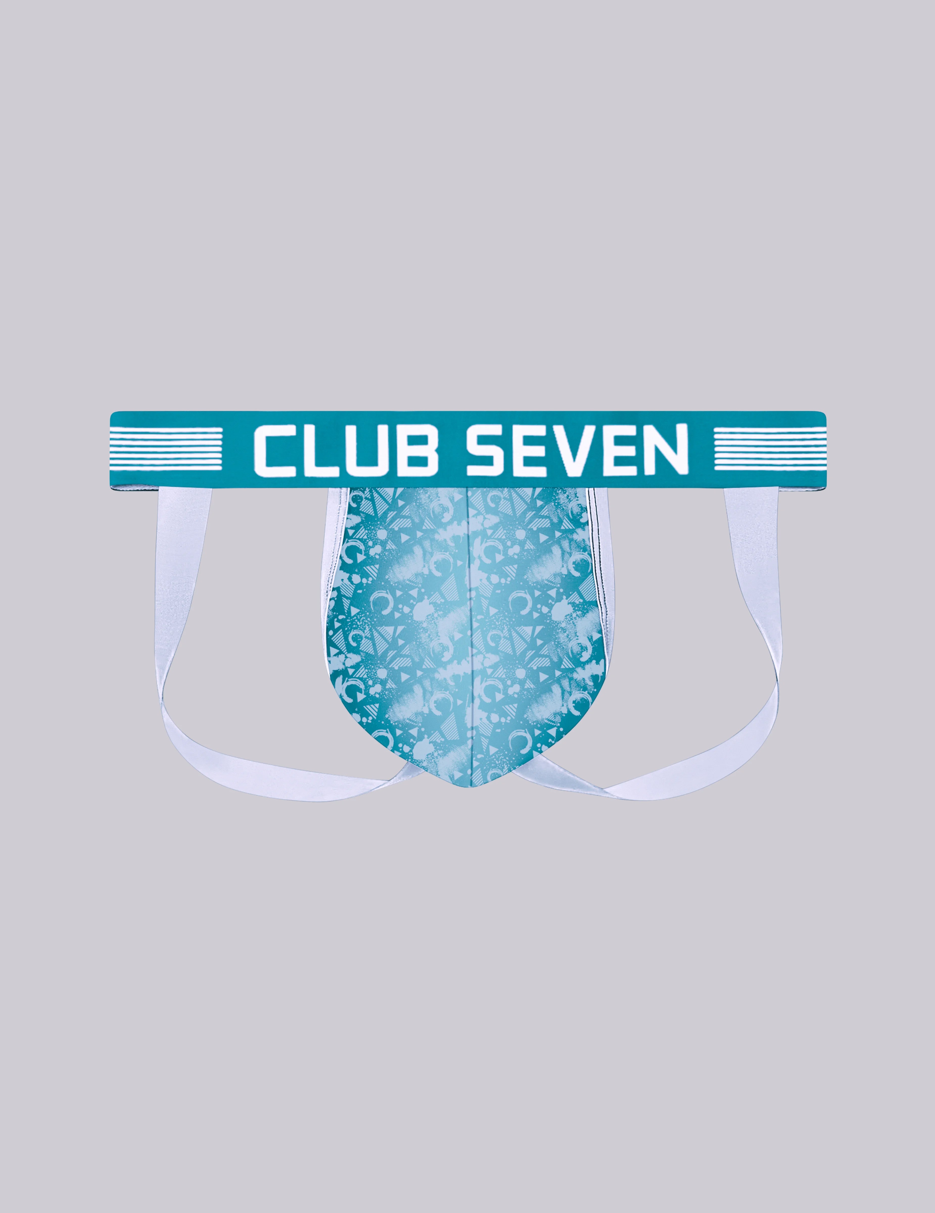 A novelty men's jockstrap with a big pouch, a teal waistband featuring the text 'CLUB SEVEN' in white, and a light blue patterned pouch, shown against a solid gray background. Designed in the UK