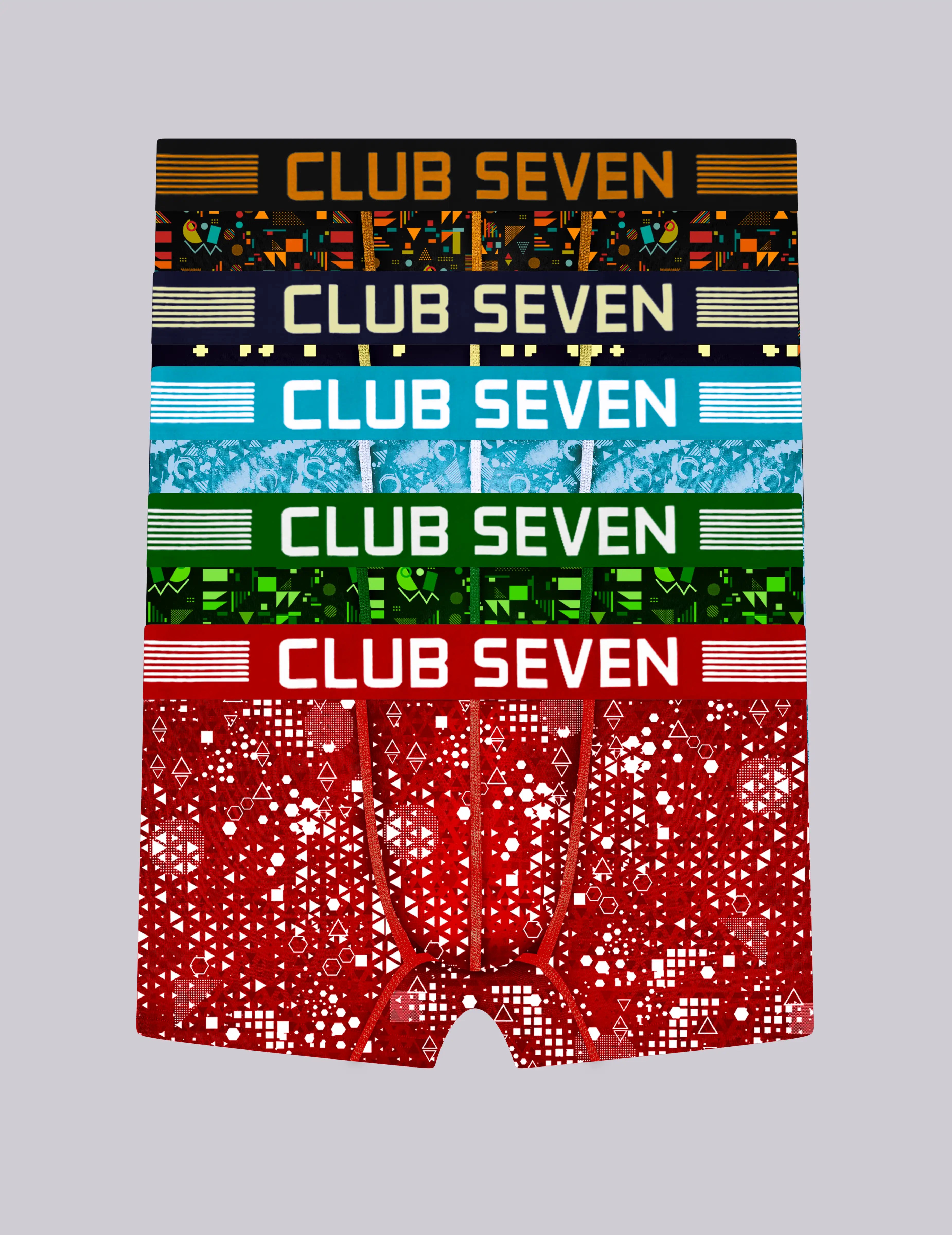 A pair of 5 men's trunks with a vibrant, stacked multicolor pattern featuring the brand name 'CLUB SEVEN' in bold text across different colour bands: black, blue, green, and red.