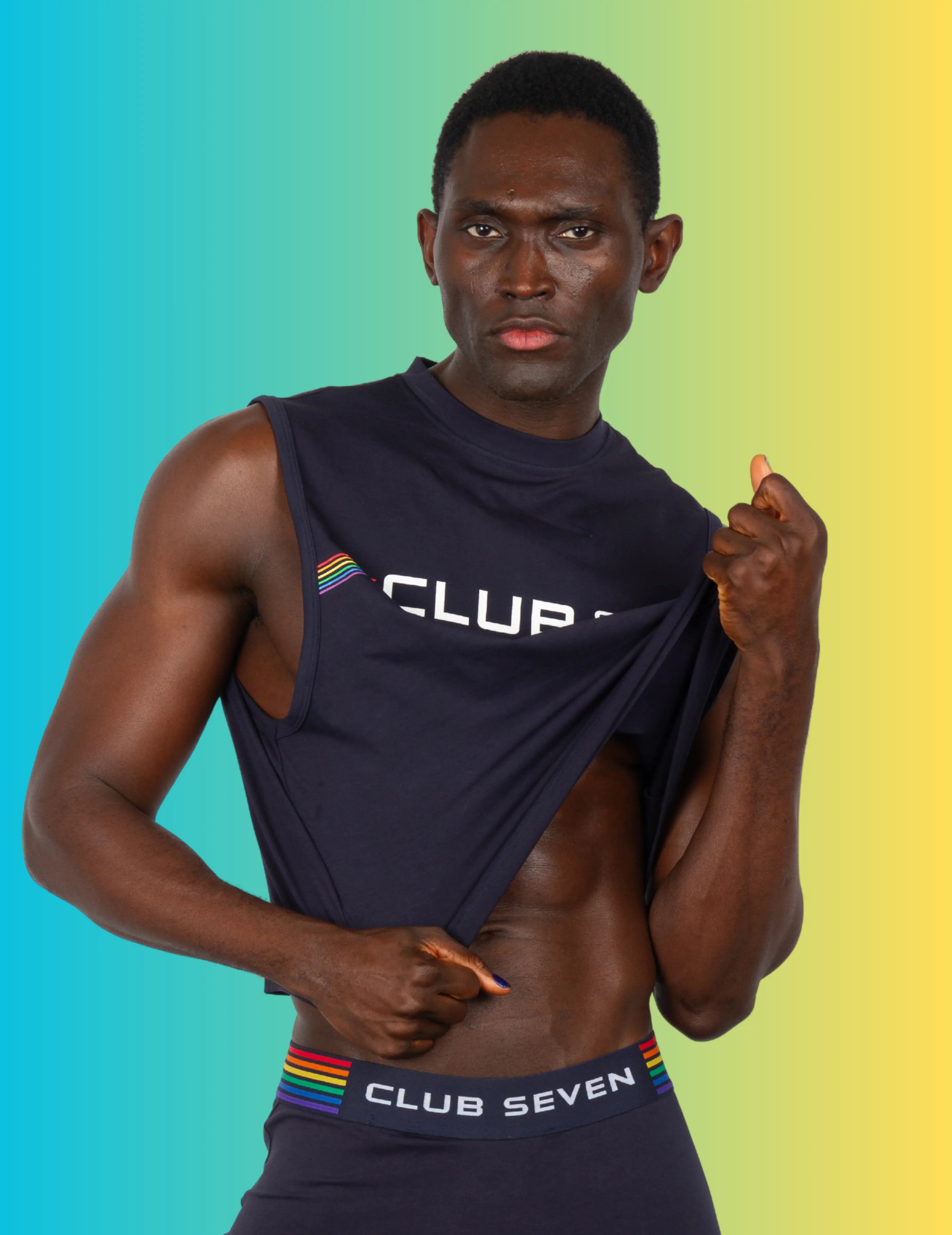 Man wearing a Pride sleeveless crop top 